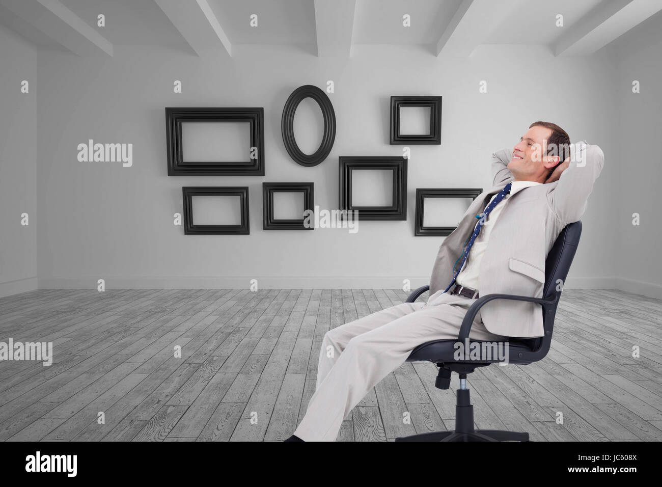 Composite image of side view of businessman leaning back in his chair