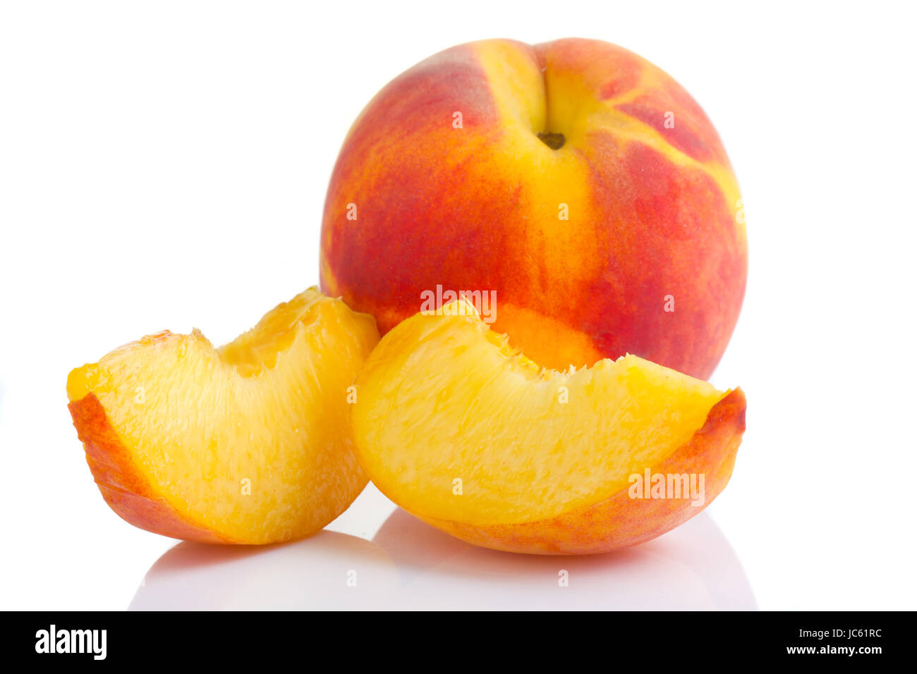 Ripe peach fruit with slices isolated on white background Stock Photo