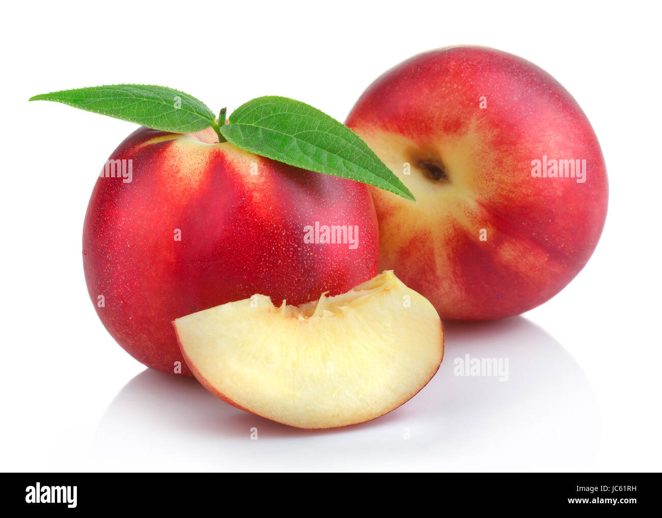 Ripe peach (nectarine) fruits with slices isolated on white background Stock Photo
