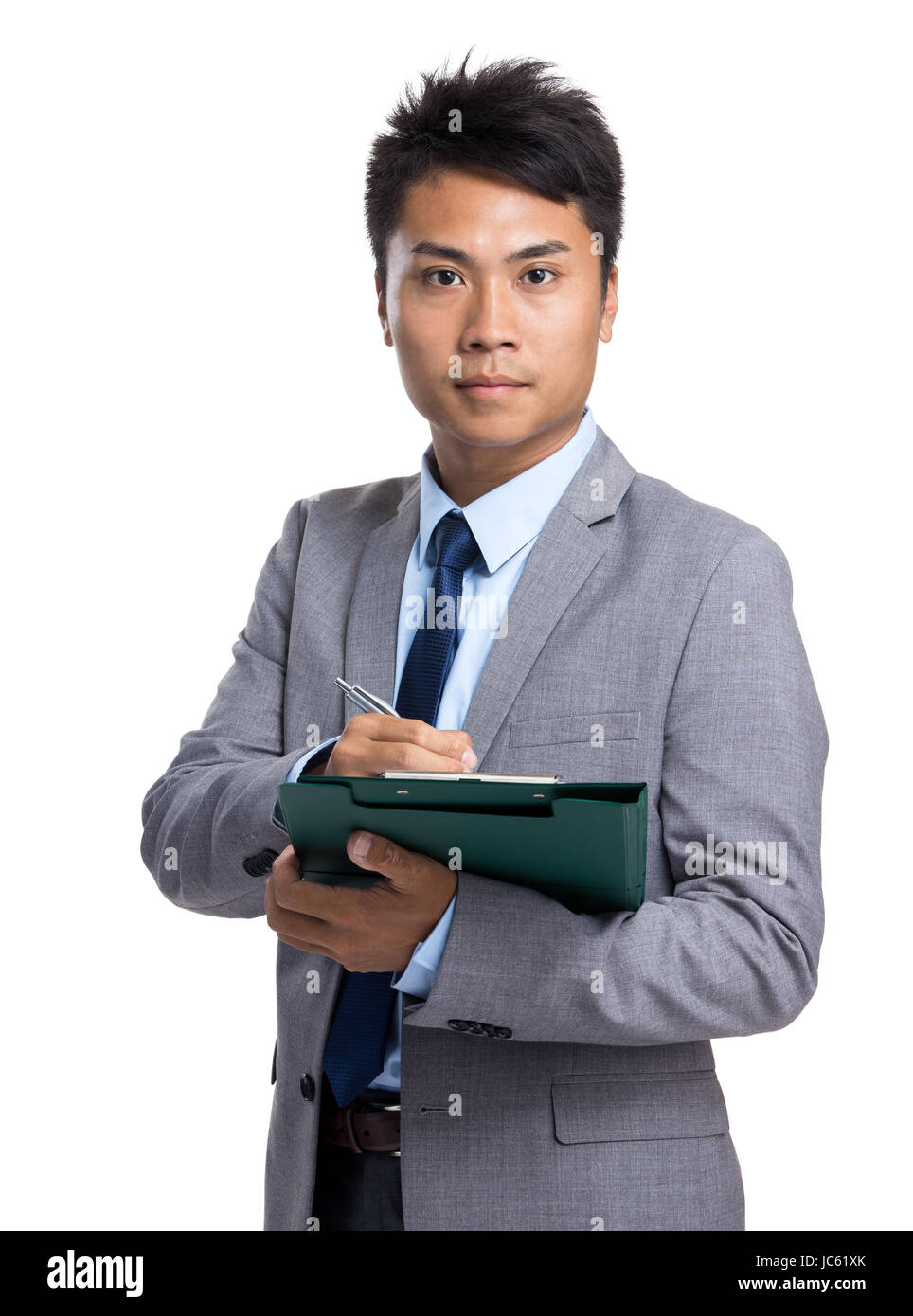 Asian businessman take note on clipboard Stock Photo - Alamy