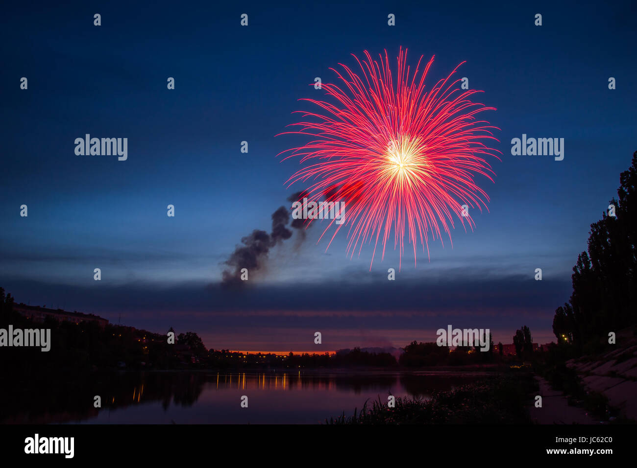 Fireworks Over Lake at Night Stock Photo