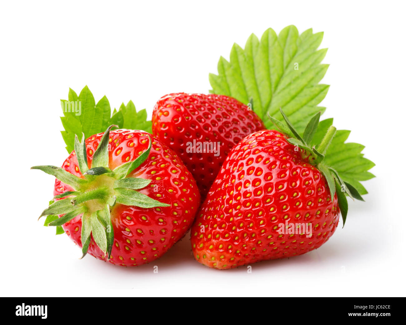 Ripe strawberries with leaves isolated on a white background Stock Photo