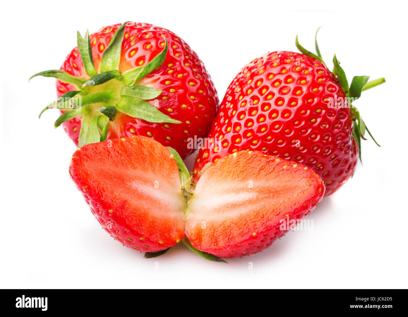 Strawberries with leaves and slices isolated on a white background Stock Photo