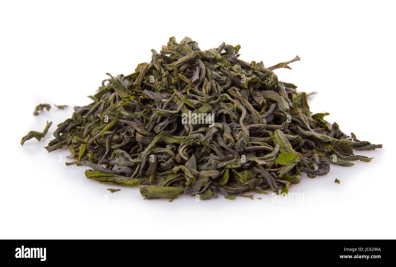 Heap of dry green tea isolated on white background Stock Photo