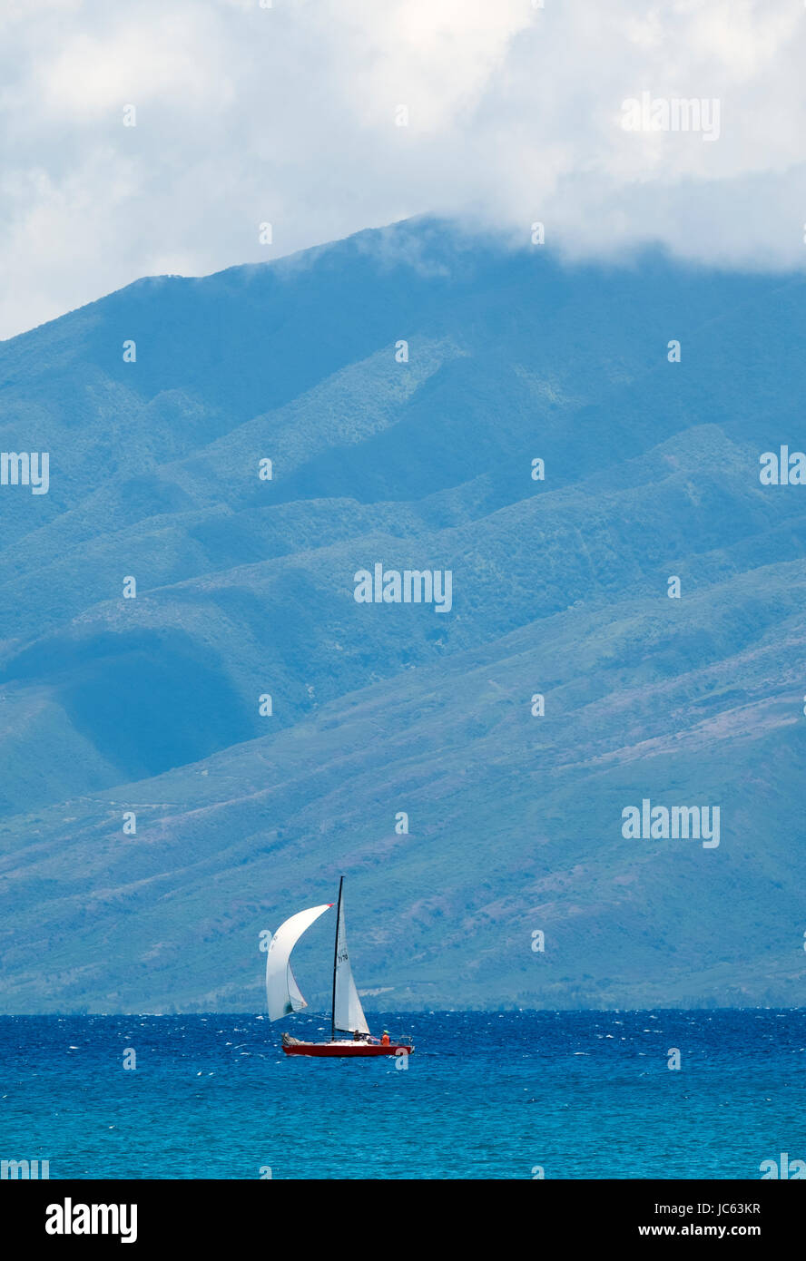 Small sailing vessel if full sail off the coast of Maui, Hawaii, USA Stock Photo