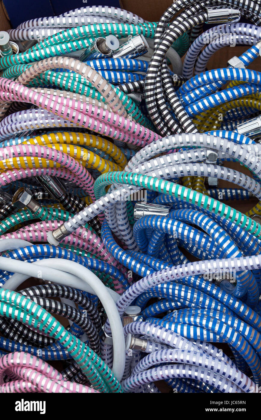 Bunch of plastic and chrome shower hoses Stock Photo Alamy