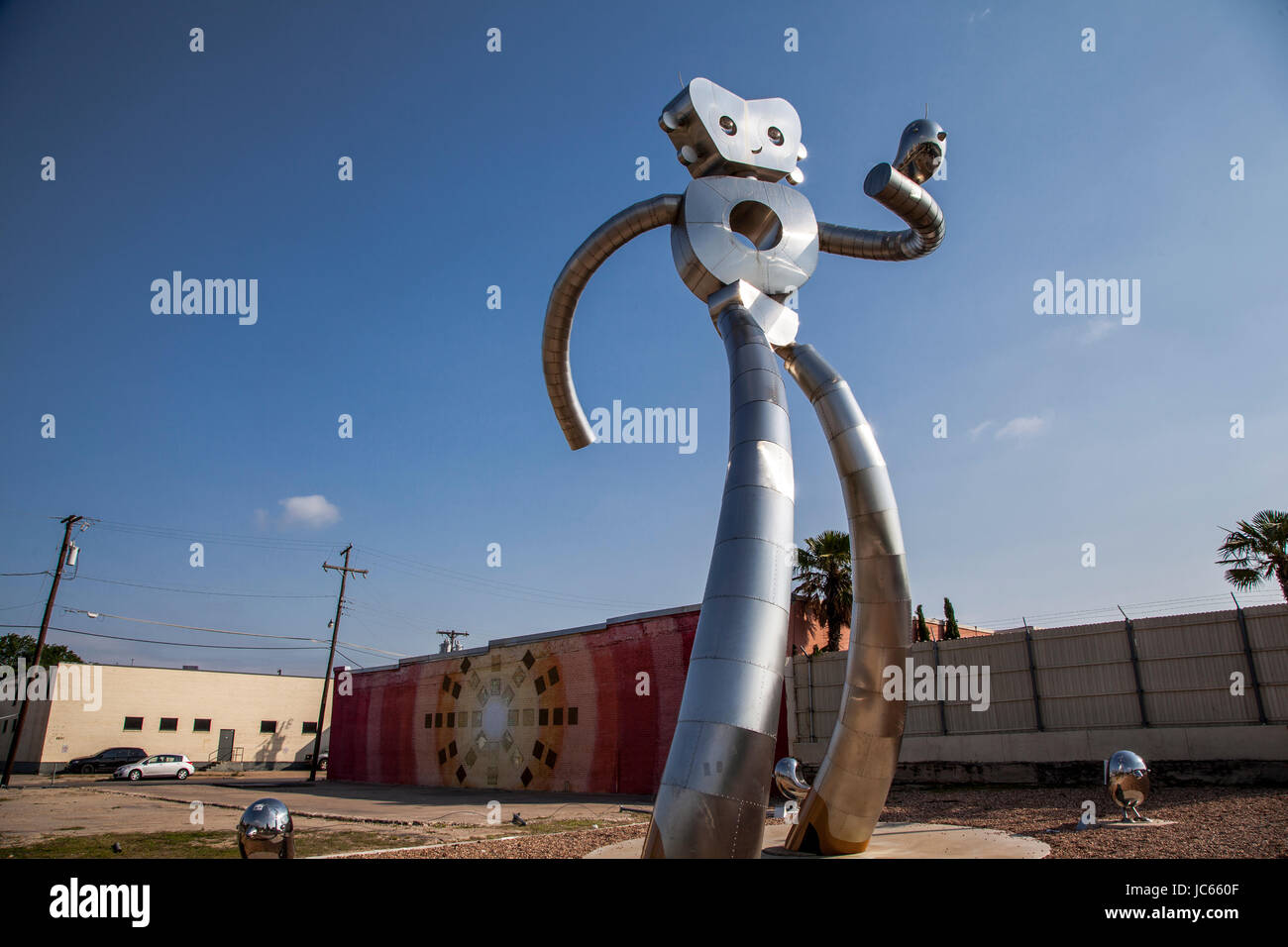 he Traveling Man, one of three stainless steel sculptures in the Deep Ellum area of Dallas, Texas Stock Photo