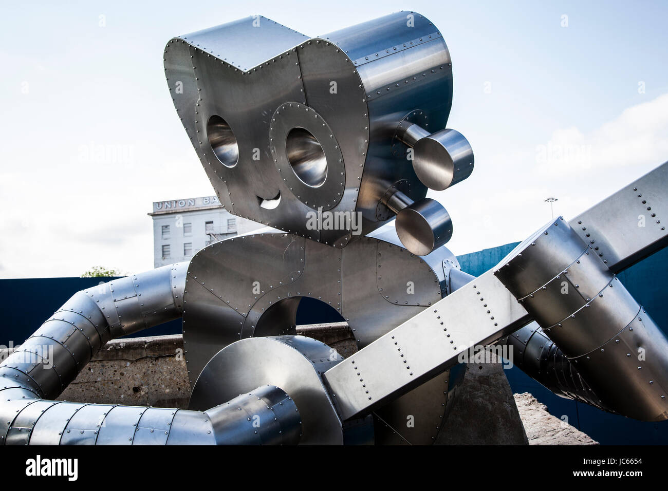 Metal sculpture 'Traveling Man', in the Deep Ellum neighborhood of Dallas, Texas Stock Photo