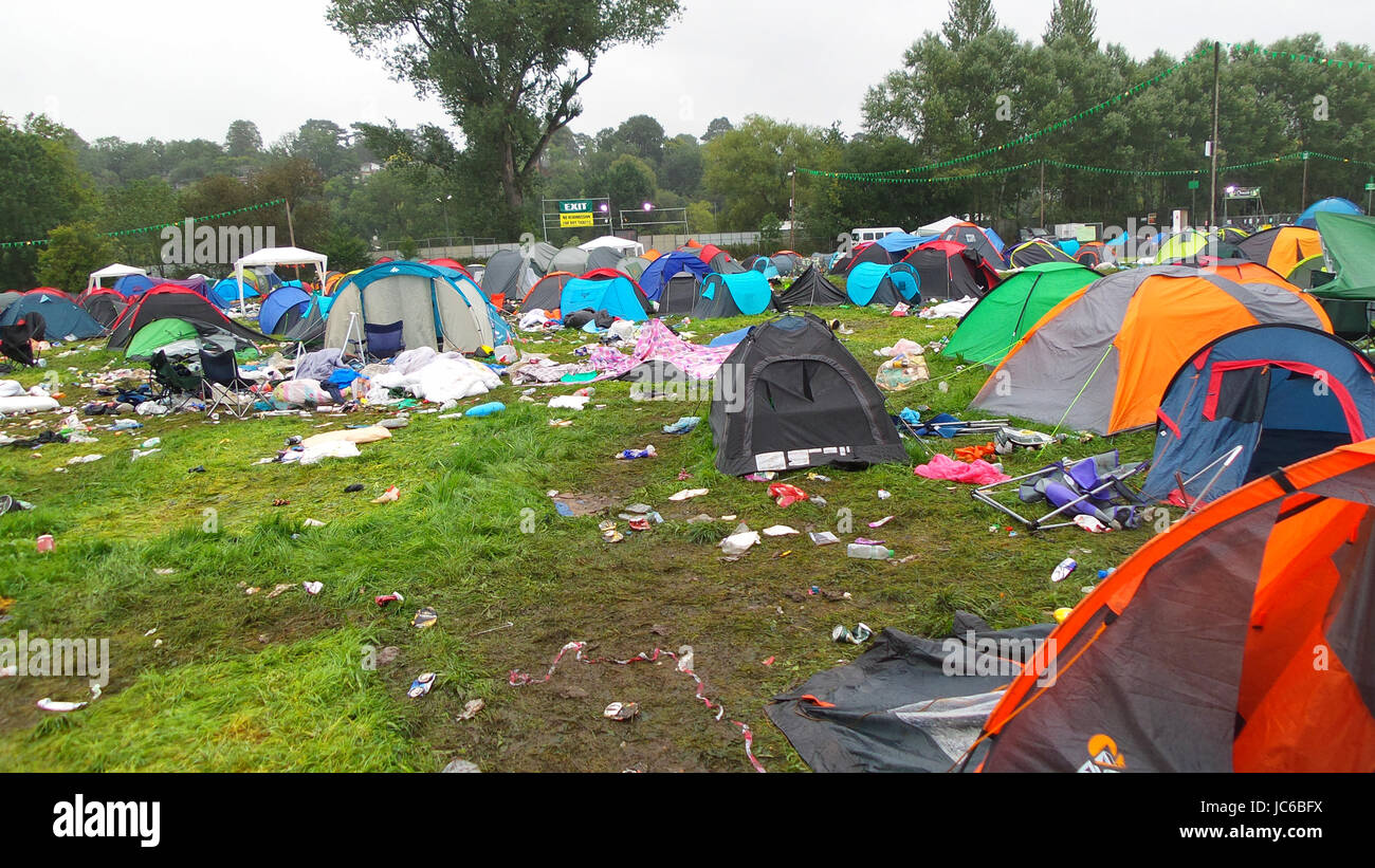 The mess that is left behind after the music festival, abandoned tents and rubbish everywhere Stock Photo