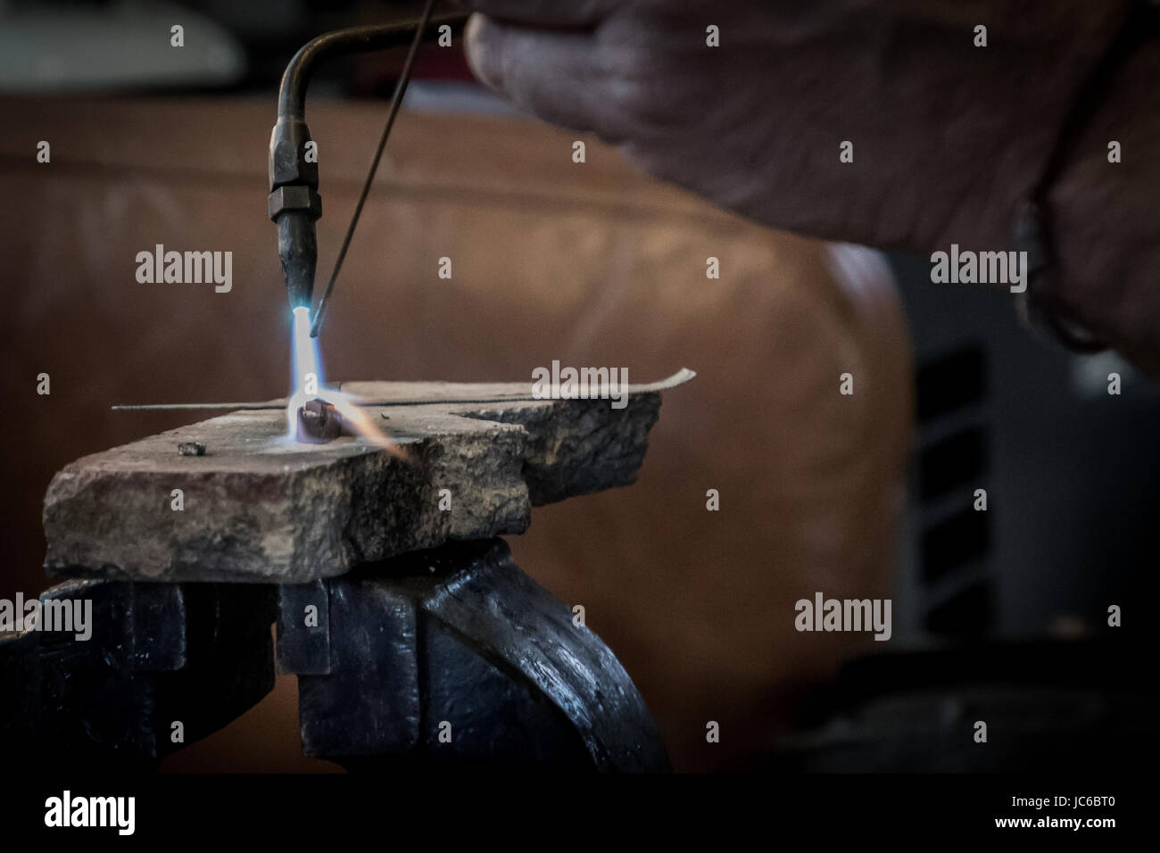 brazing torch soldering a car part in garage Stock Photo Alamy