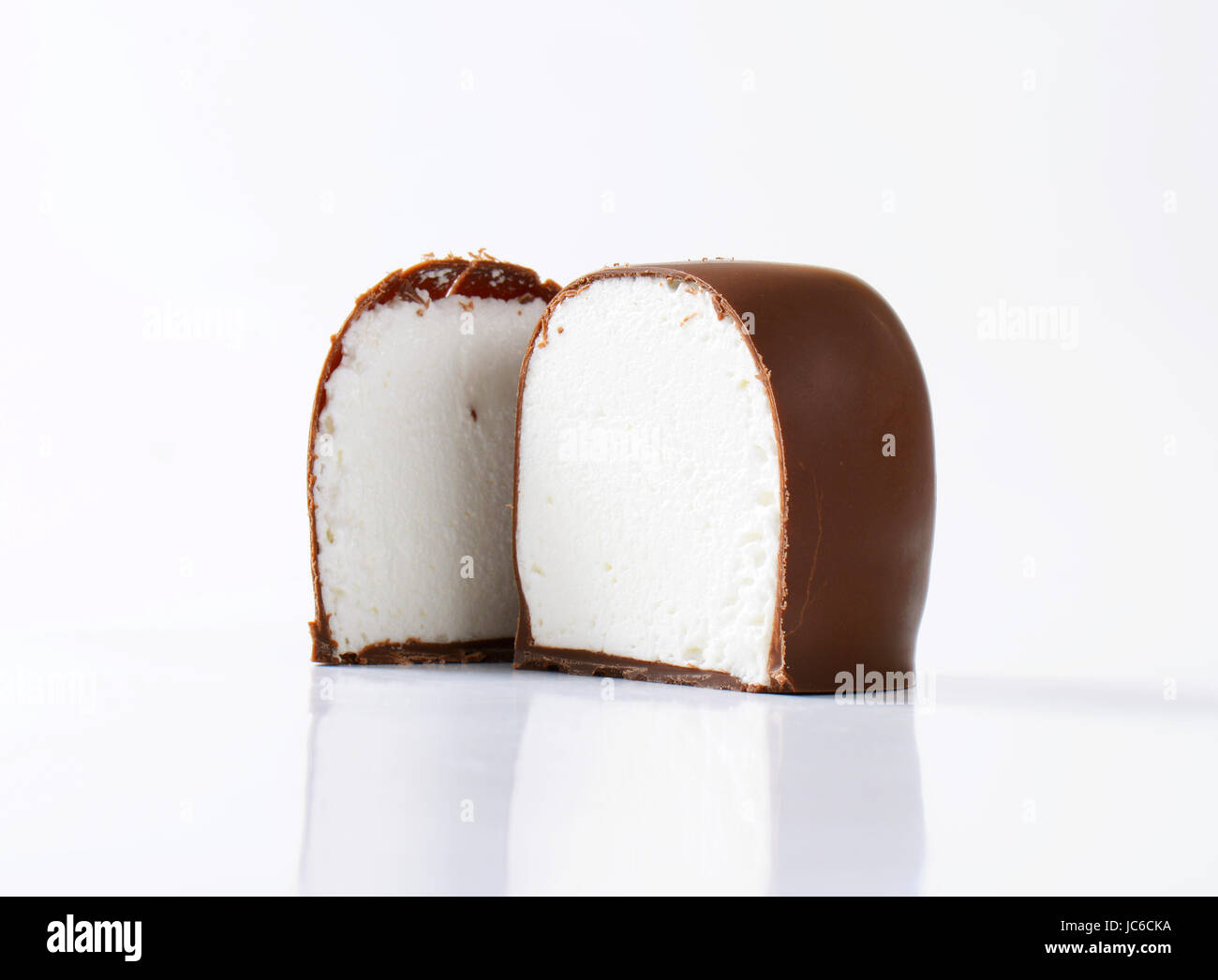 Marshmallows coated in milk chocolate Stock Photo Alamy