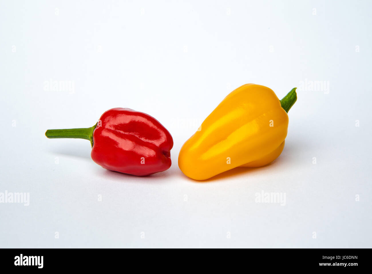 yellow and red chili pepper isolated on a white background Stock Photo ...