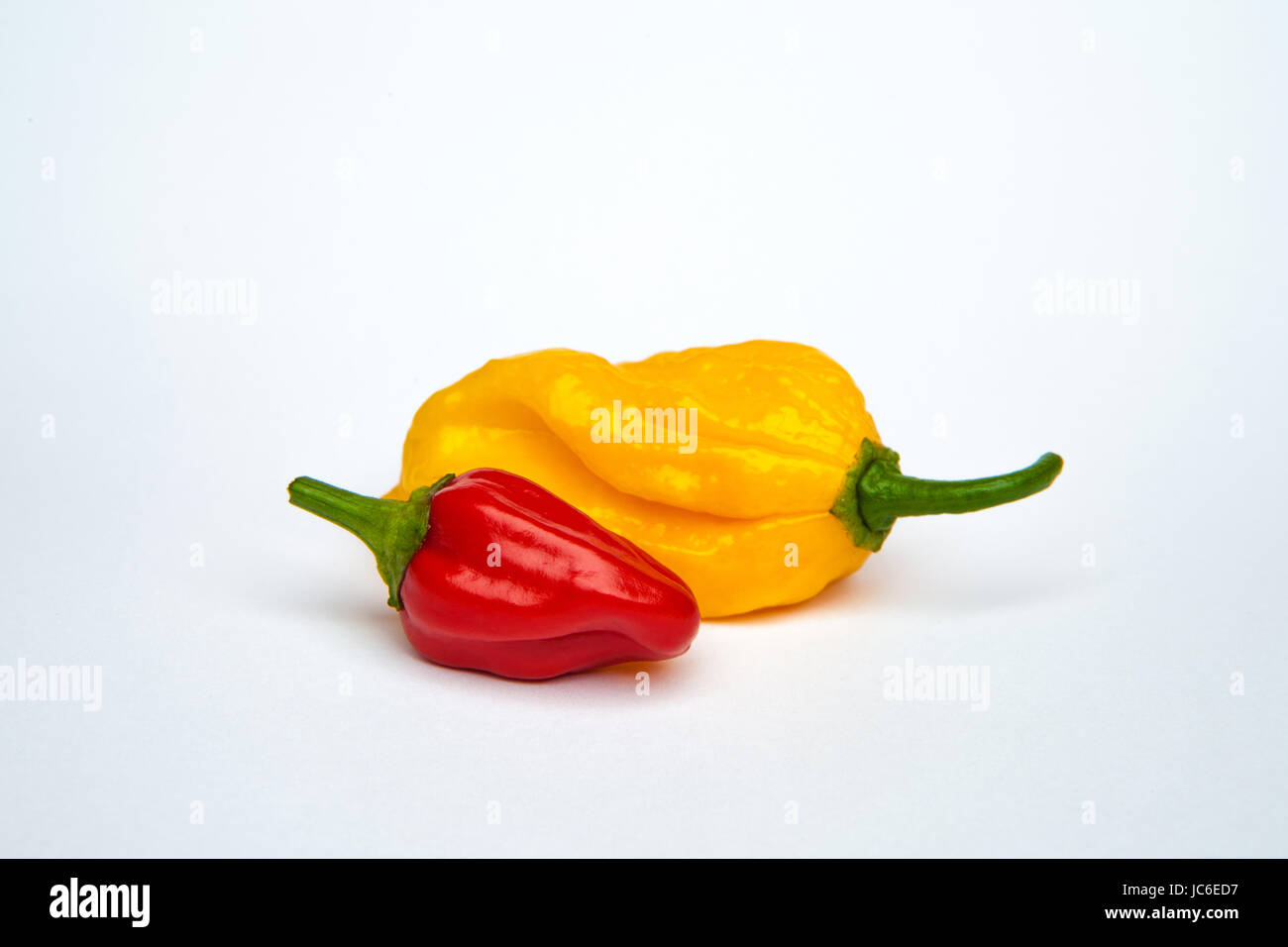 yellow and red chili pepper isolated on a white background Stock Photo ...