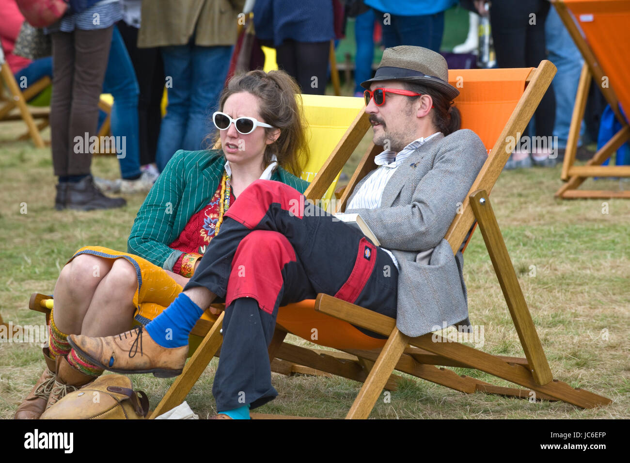 Man & woman relaxing in deckchairs at Hay Festival of Literature and the Arts 2017 Hay-on-Wye Powys Wales UK Stock Photo
