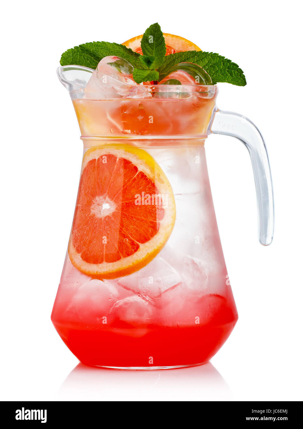 Full jug of fresh nonalcoholic cocktail with grapefruit and green mint isolated Stock Photo
