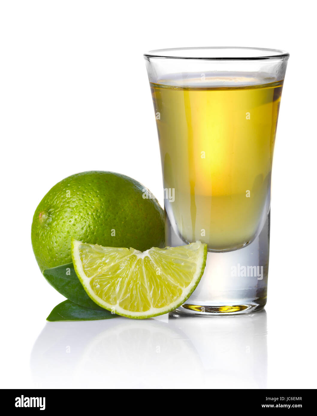 Gold tequila shot with lime isolated on white background Stock Photo