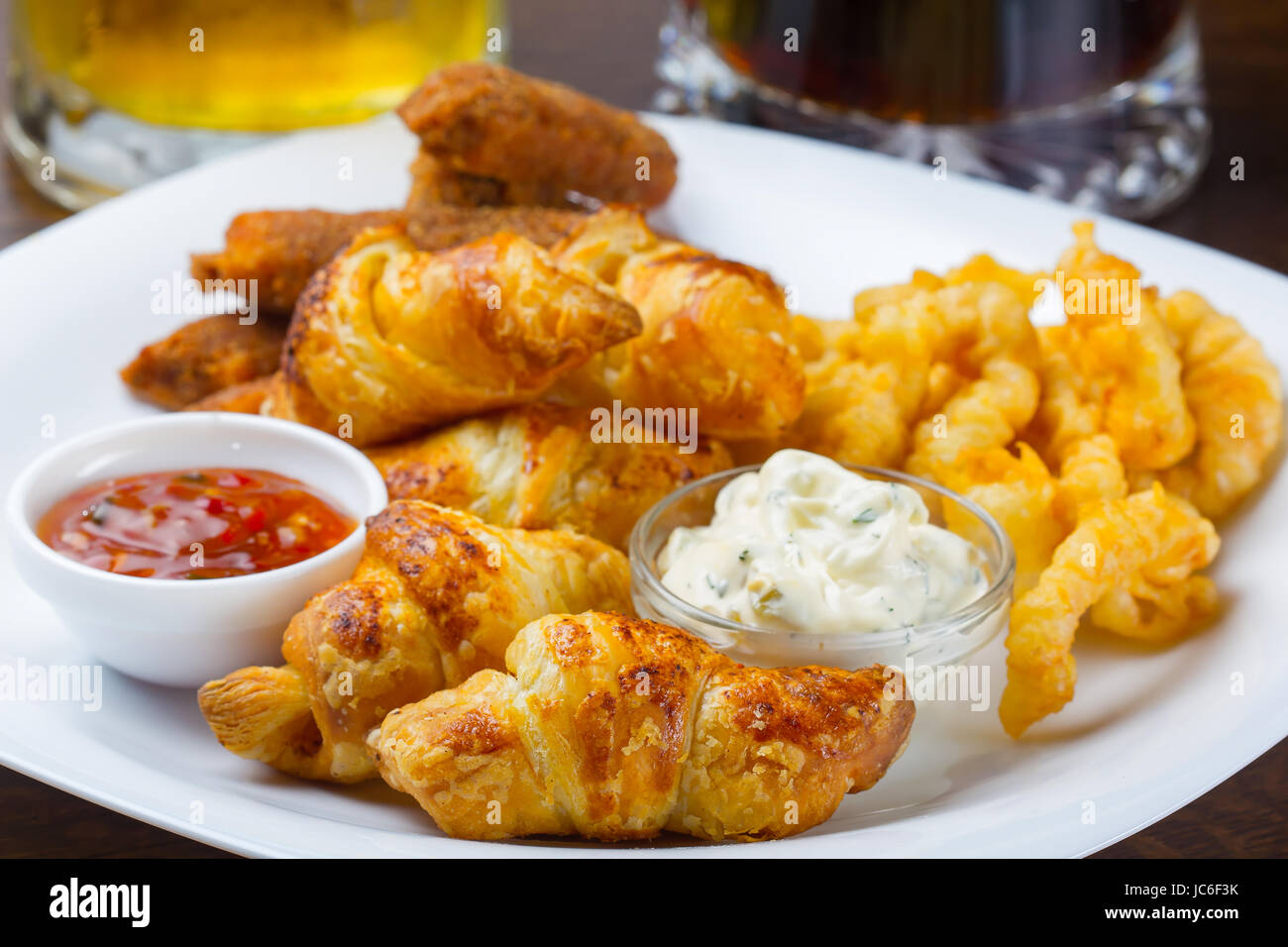Fresh golden croissants with jams for breakfast Stock Photo