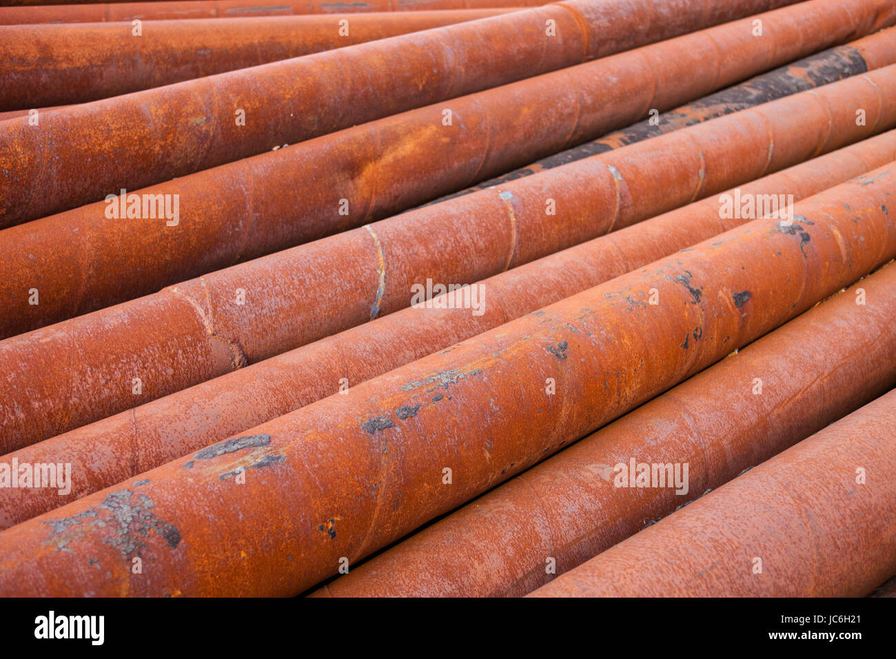 Rusty metal pipes stack Stock Photo - Alamy