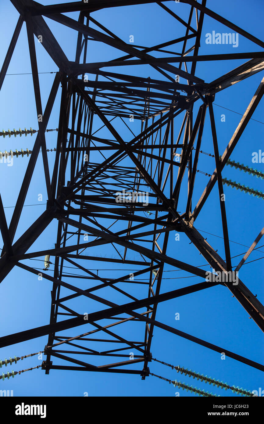 Electricity pylon against the blue sky background Stock Photo - Alamy