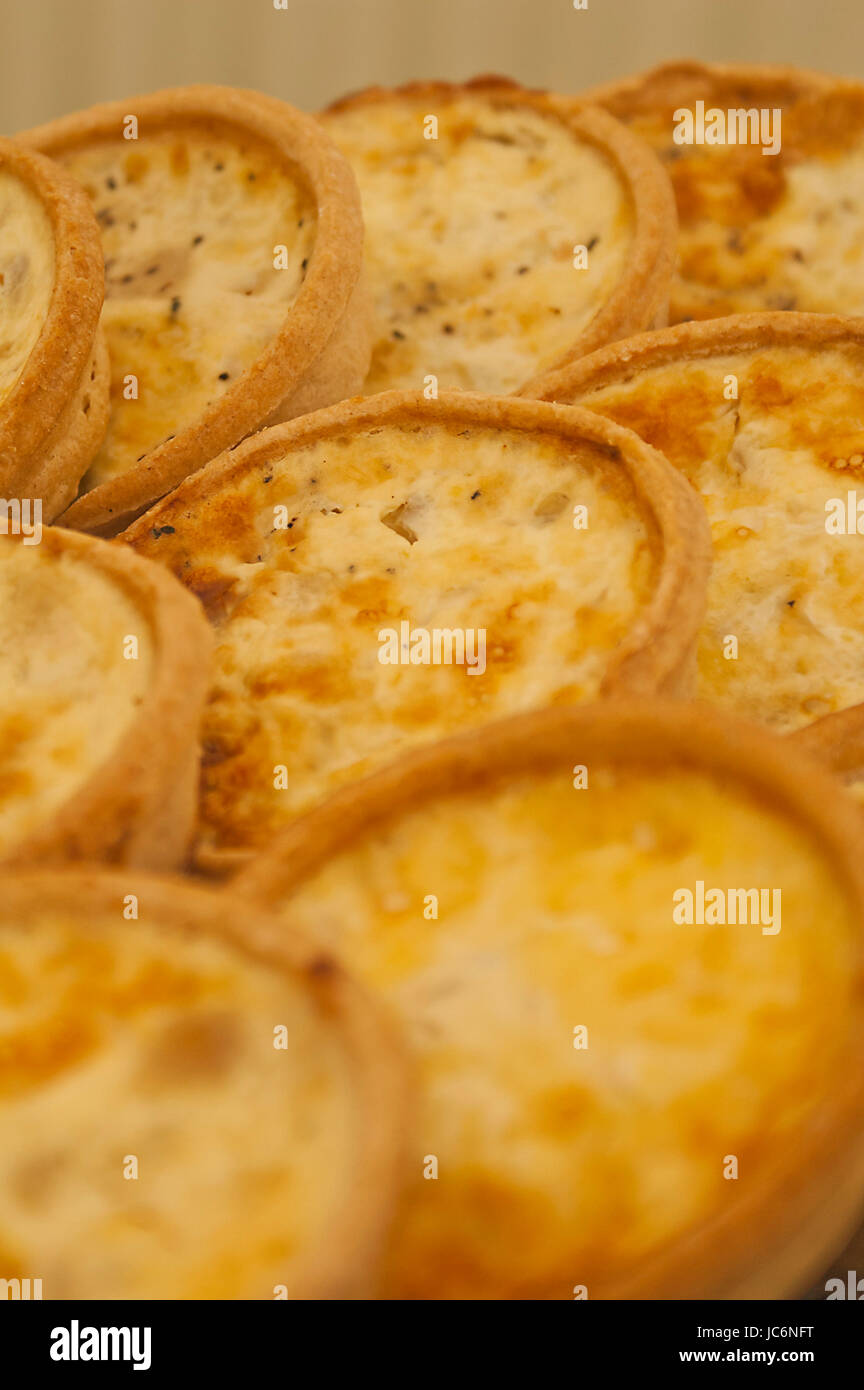 A tray of small individual quiche lorraine Stock Photo Alamy