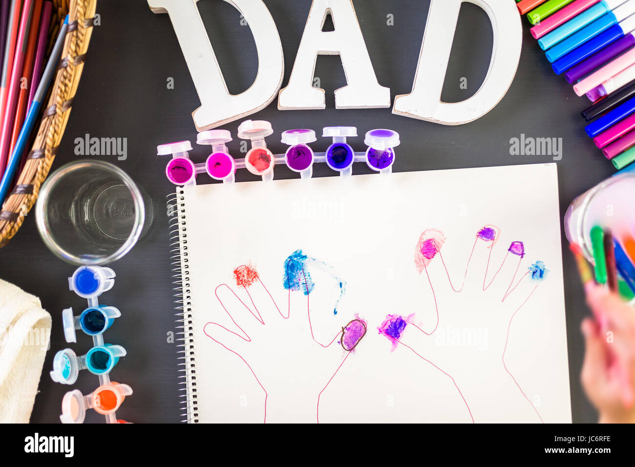 Step by step. Little girl tracing her hands for Father's Day card Stock ...