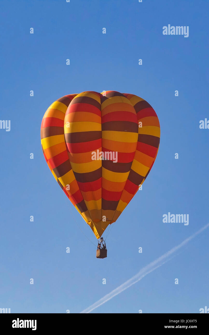 Balloons float over vineyard and Hot Air  Balloon Festival Stock Photo