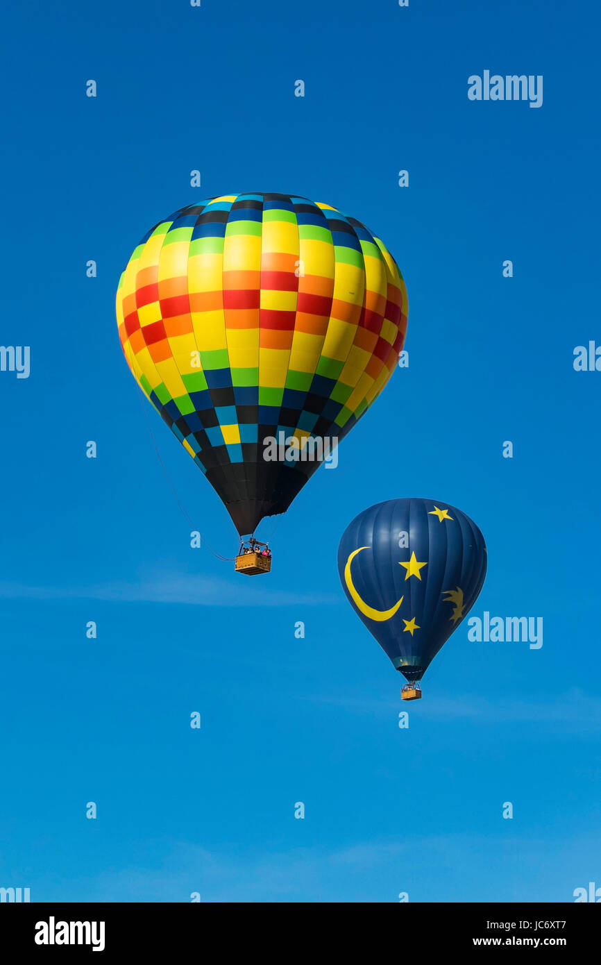 Balloons float over vineyard and Hot Air  Balloon Festival Stock Photo