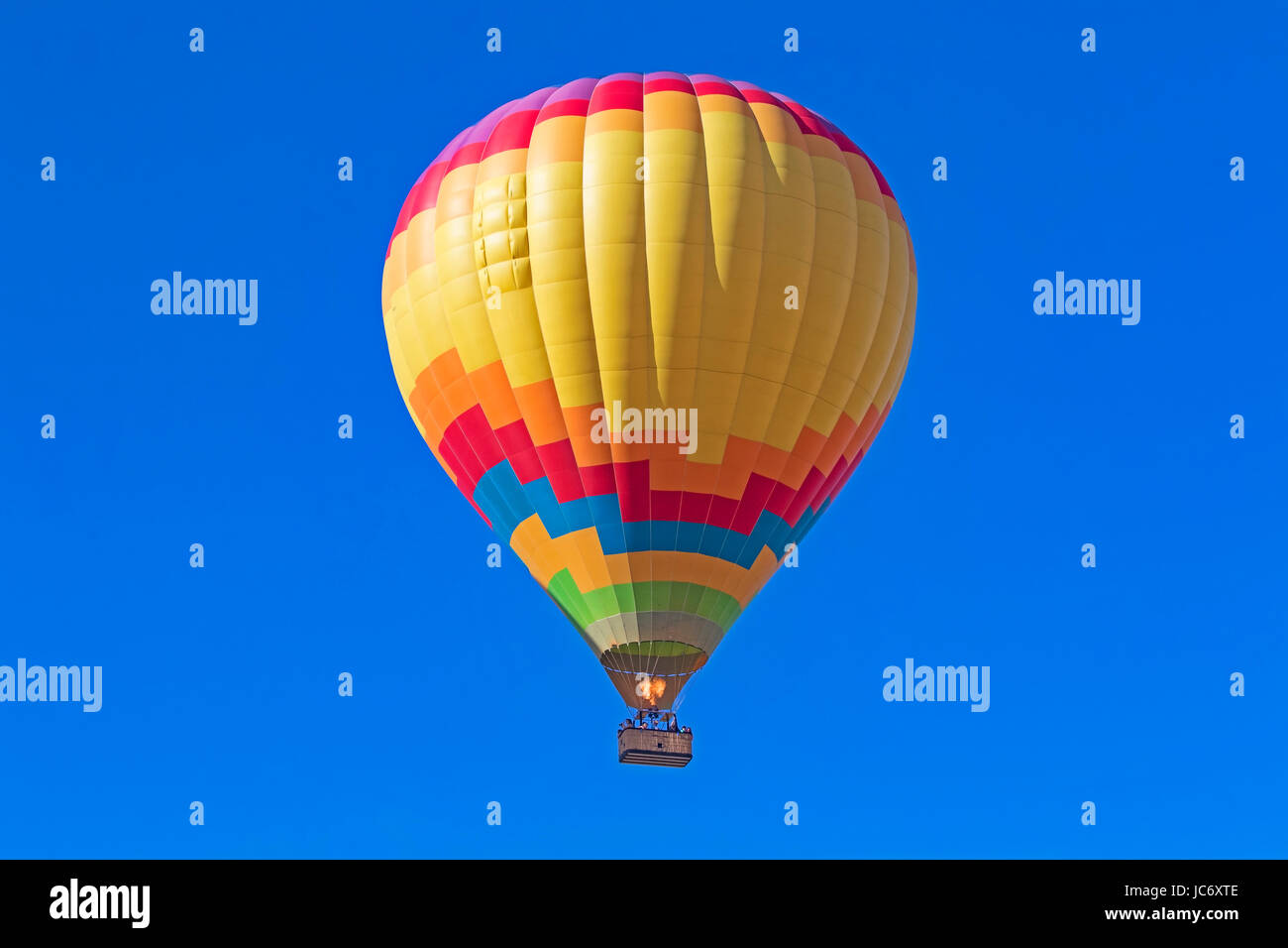 Balloons float over vineyard and Hot Air Balloon Festival Stock Photo