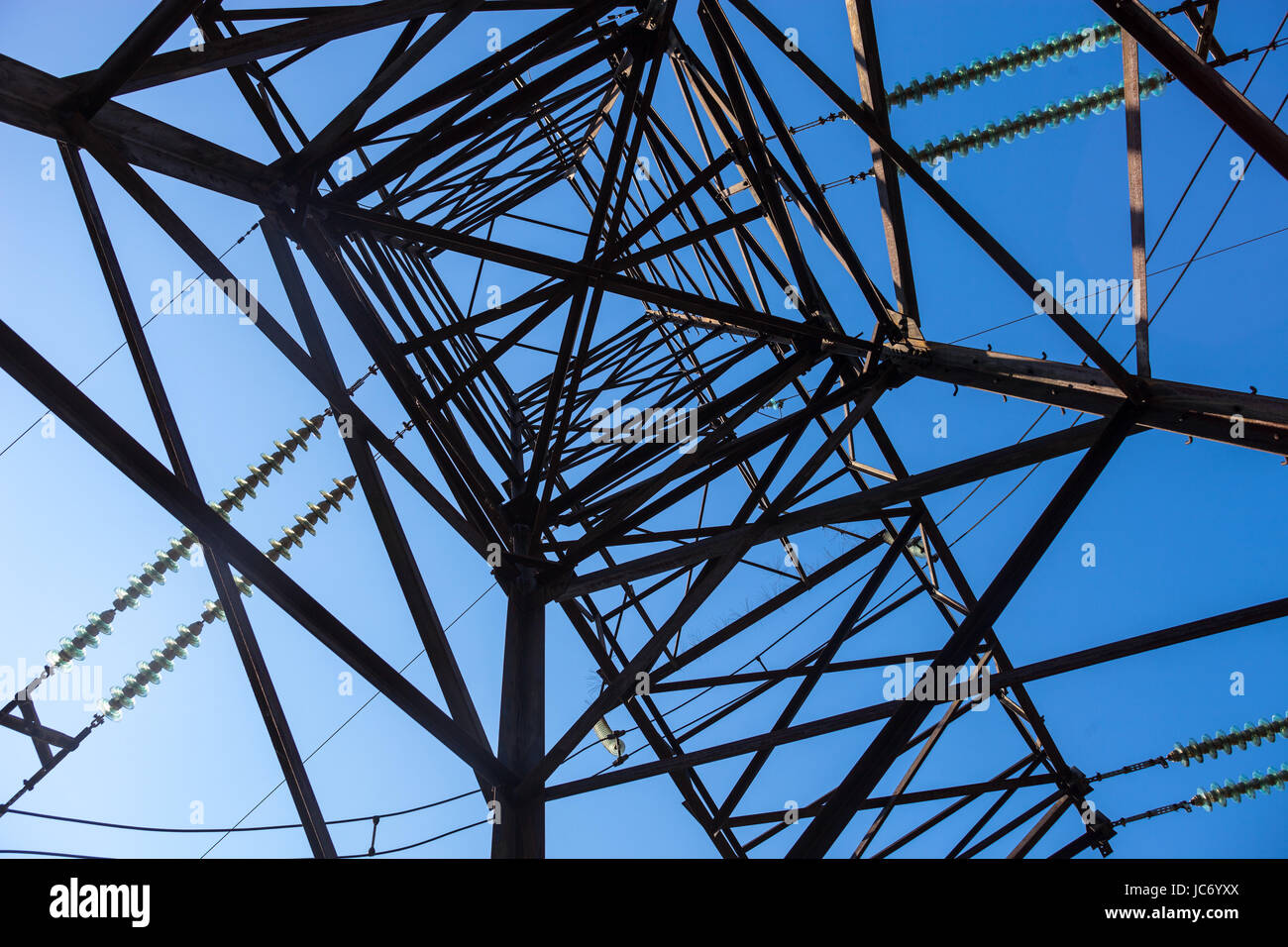 Electricity pylon against the blue sky background Stock Photo - Alamy
