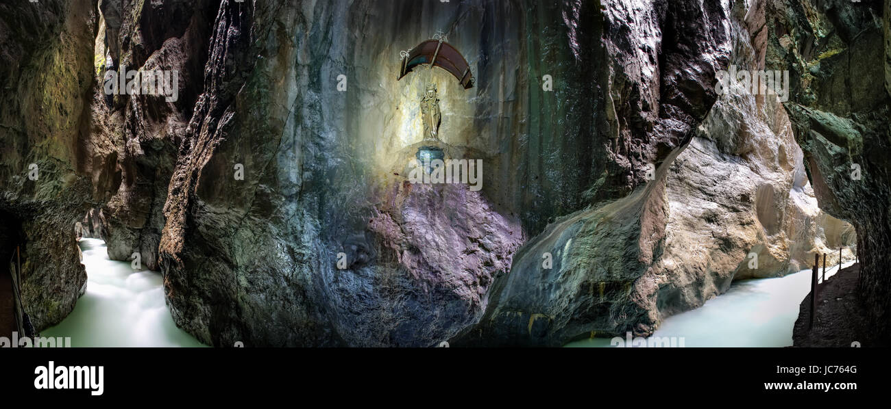 panorama-image-of-river-partnachklamm-with-maria-statue-in-garmisch