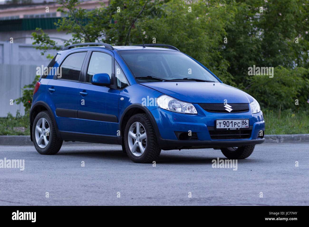 Ekaterinburg, Russia June 11, 2017 - Suzuki SX4 car of blue color stands on the asphalt parking lot in the evening Stock Photo