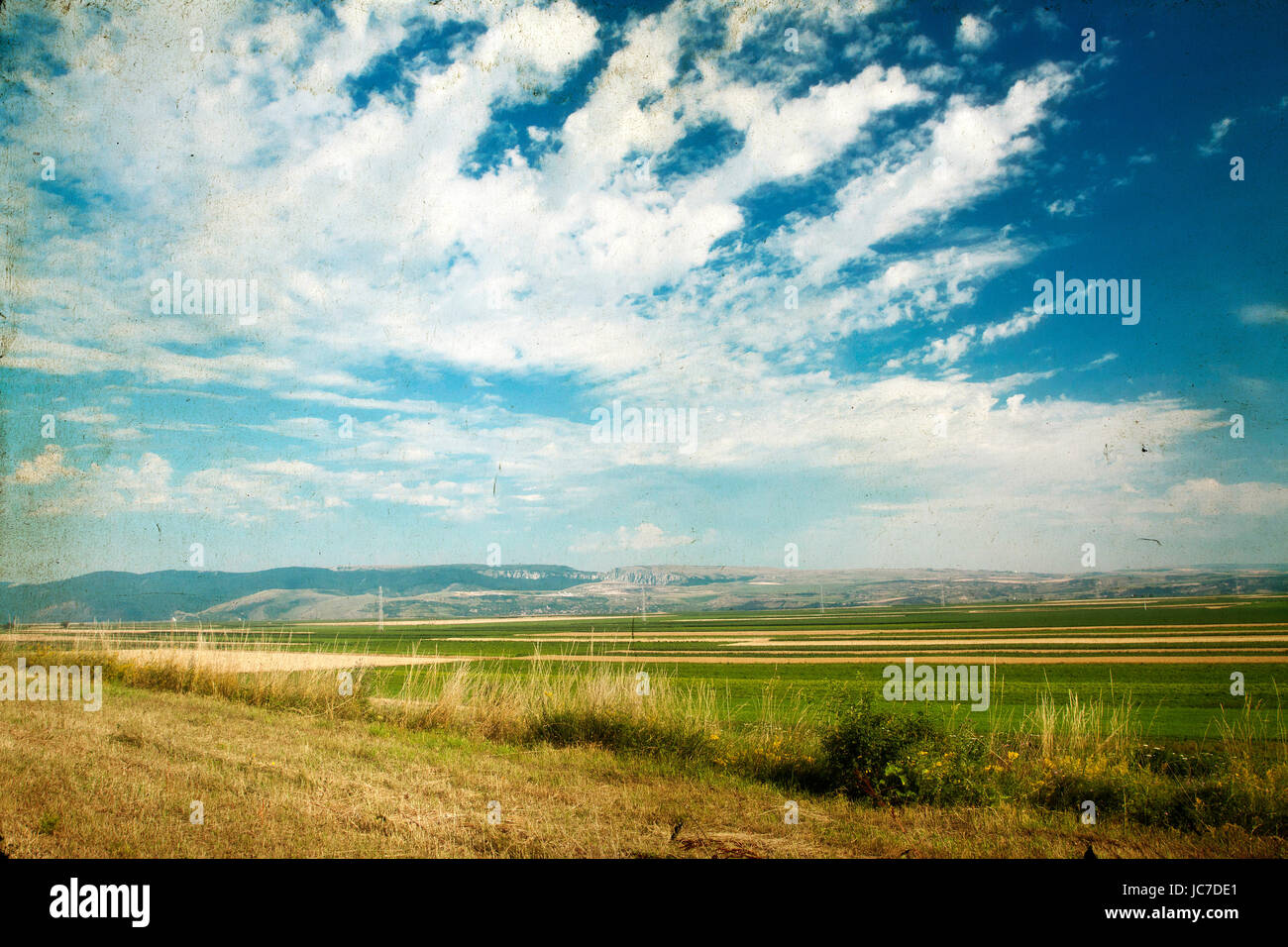 Vintage photo of field and blue sky - rural panoramic landscape Stock ...