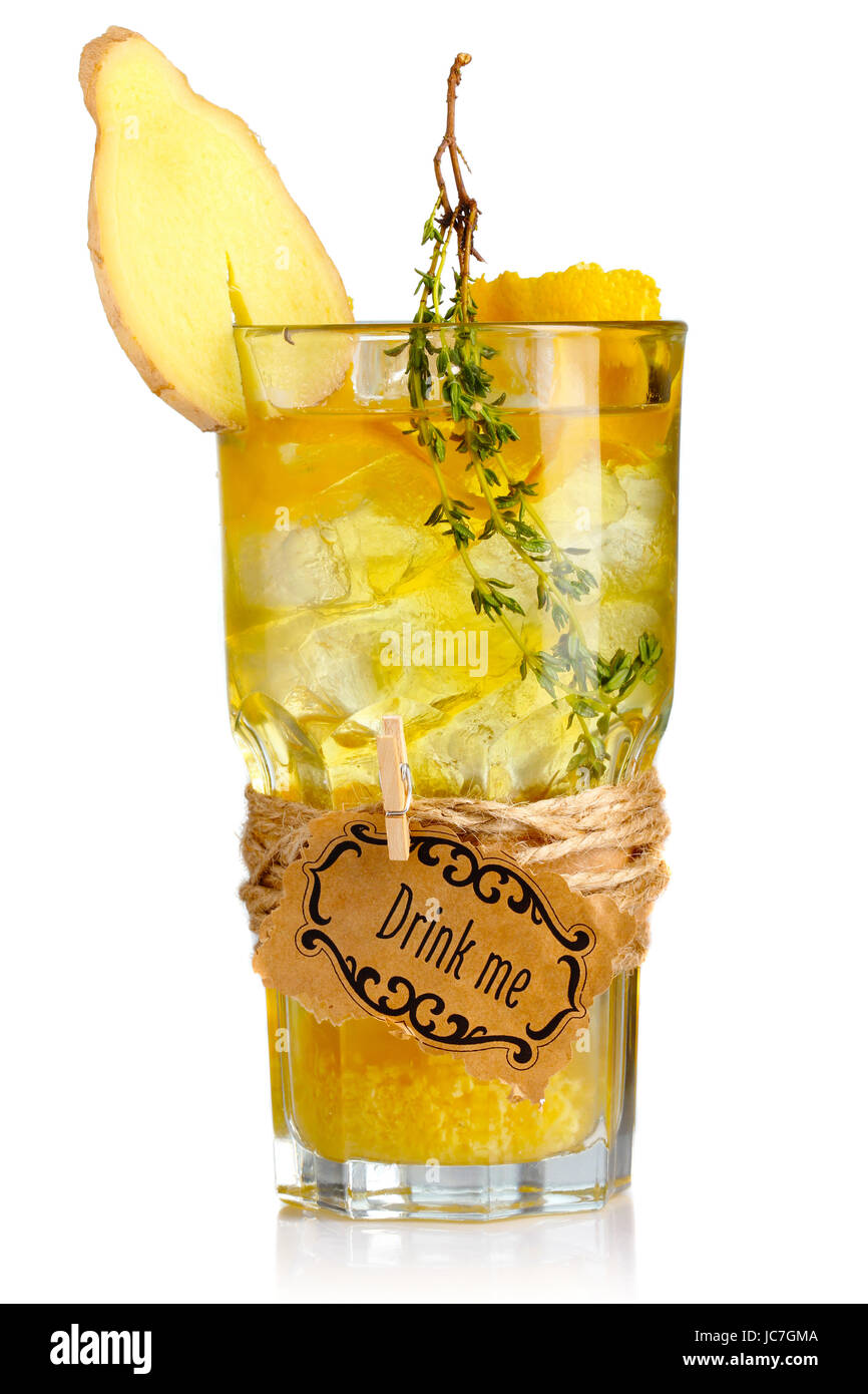 Yellow alcohol cocktail in glass with ginger slice and spices isolated Stock Photo