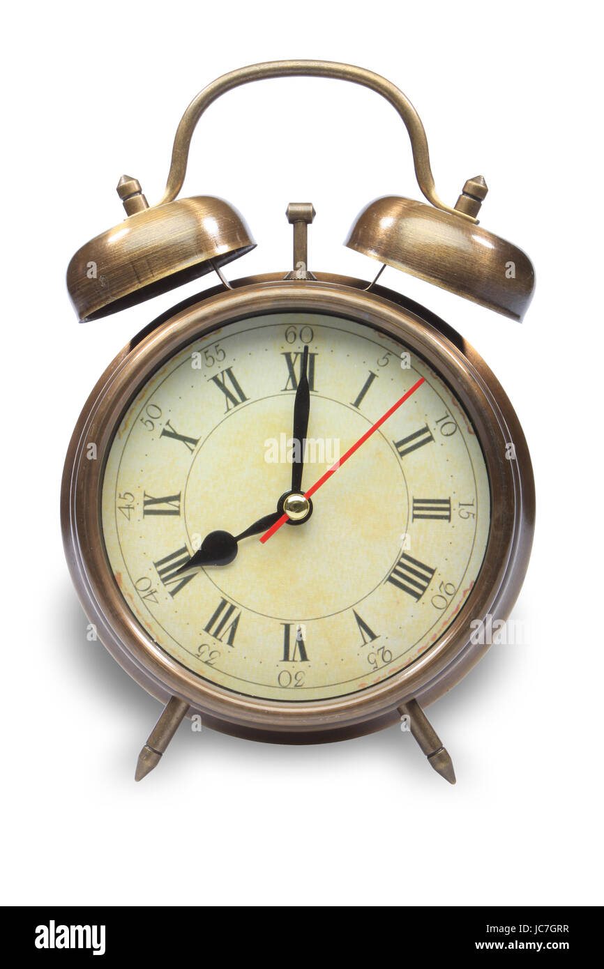 An old fashioned alarm clock at eight oclock Stock Photo