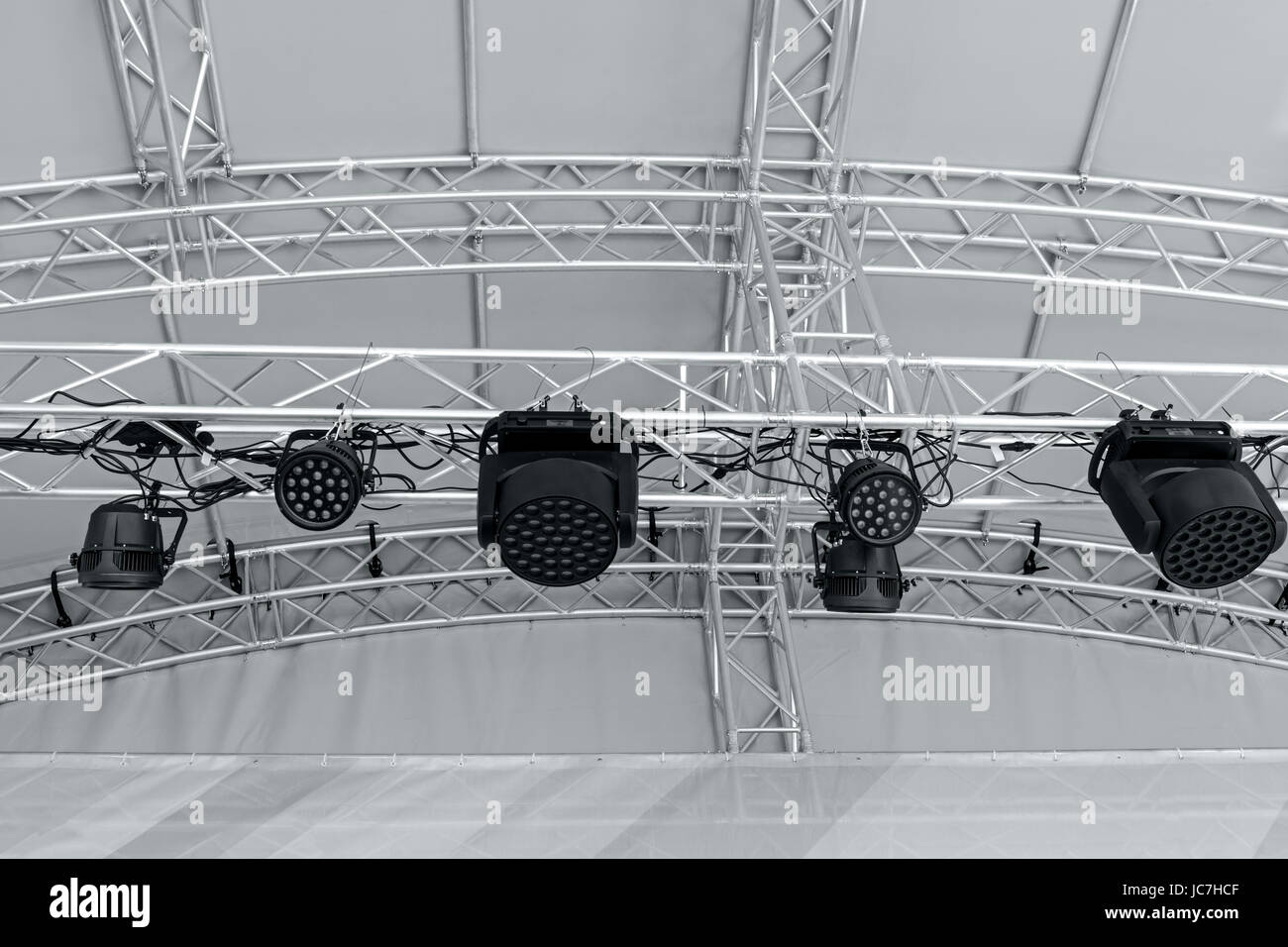 spotlights on stage lighting rig. stage light equipment before concert. Stock Photo