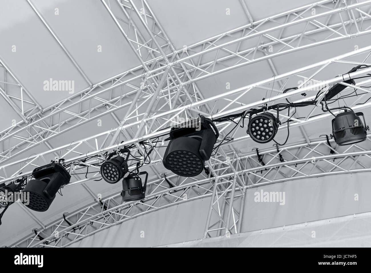 professional stage spotlight equipment. multiple spotlights on outdoor stage. Stock Photo