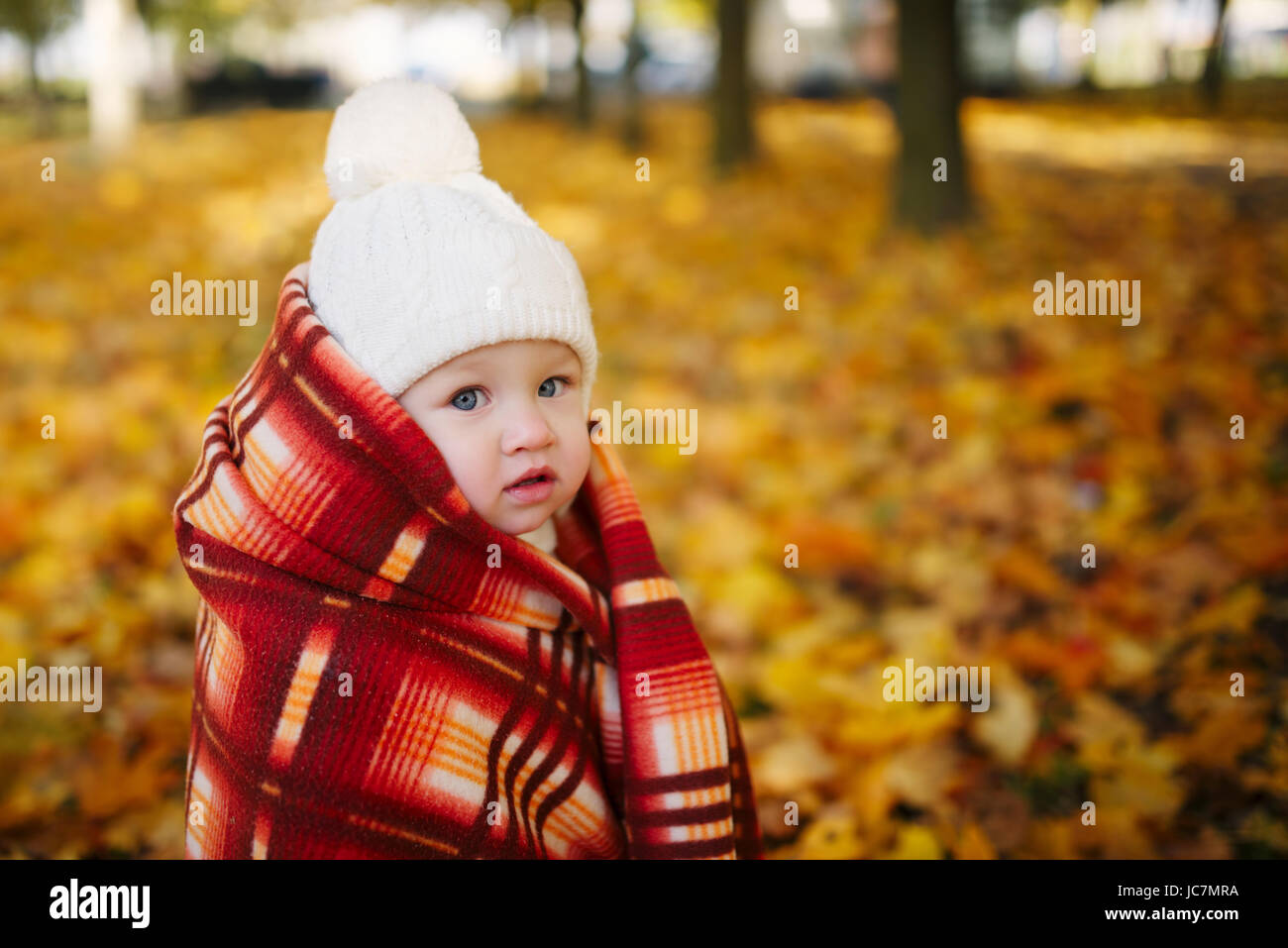 Baby in yellow blanket hi-res stock photography and images - Alamy