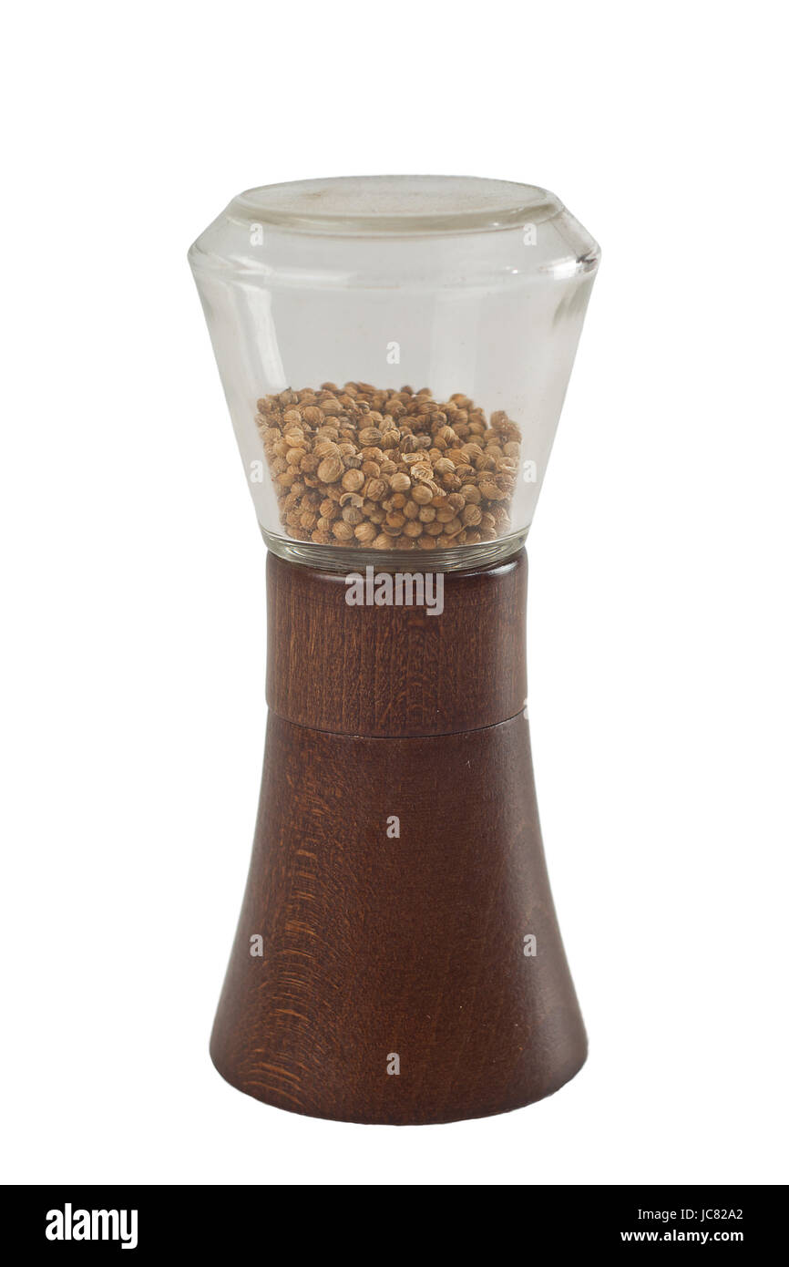 Isolated spice grinder with coriander on white background Stock Photo ...
