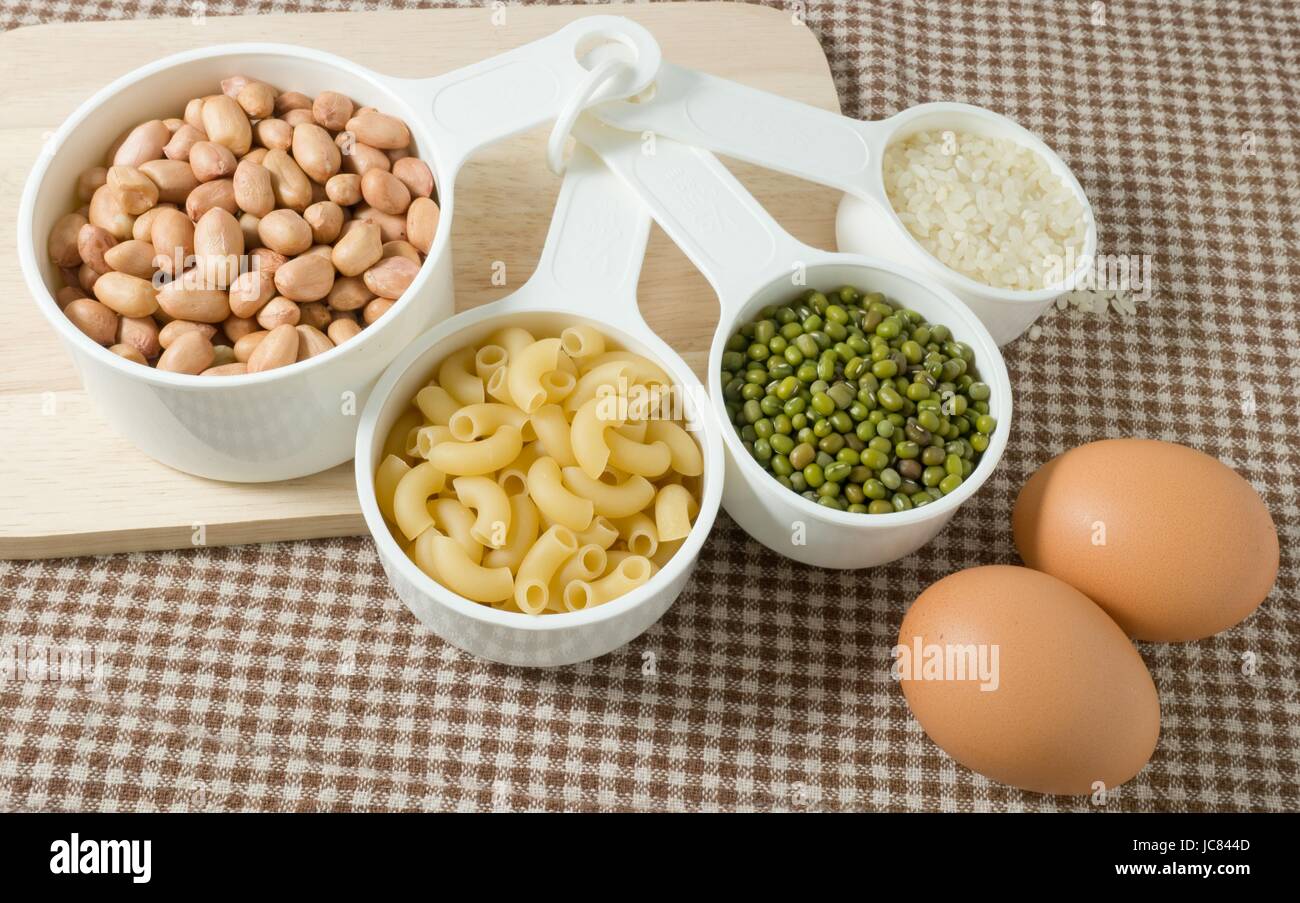 Food Ingredient, Pasta, Rice, Peanuts, Mung Beans and Egg High in Carbohydrate and Protein. Stock Photo