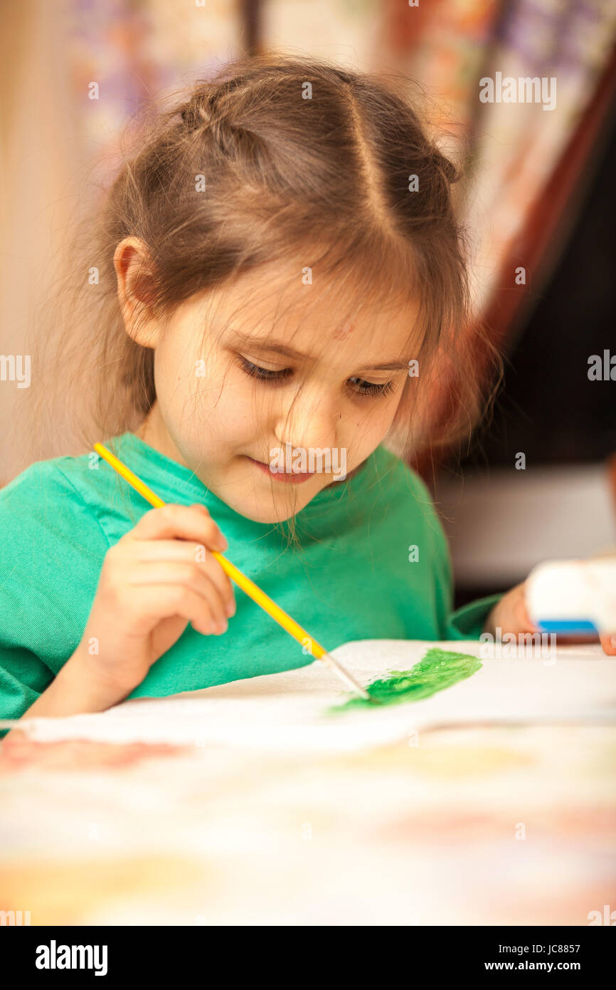 Portrait of young schoolgirl drawing with watercolors Stock Photo - Alamy