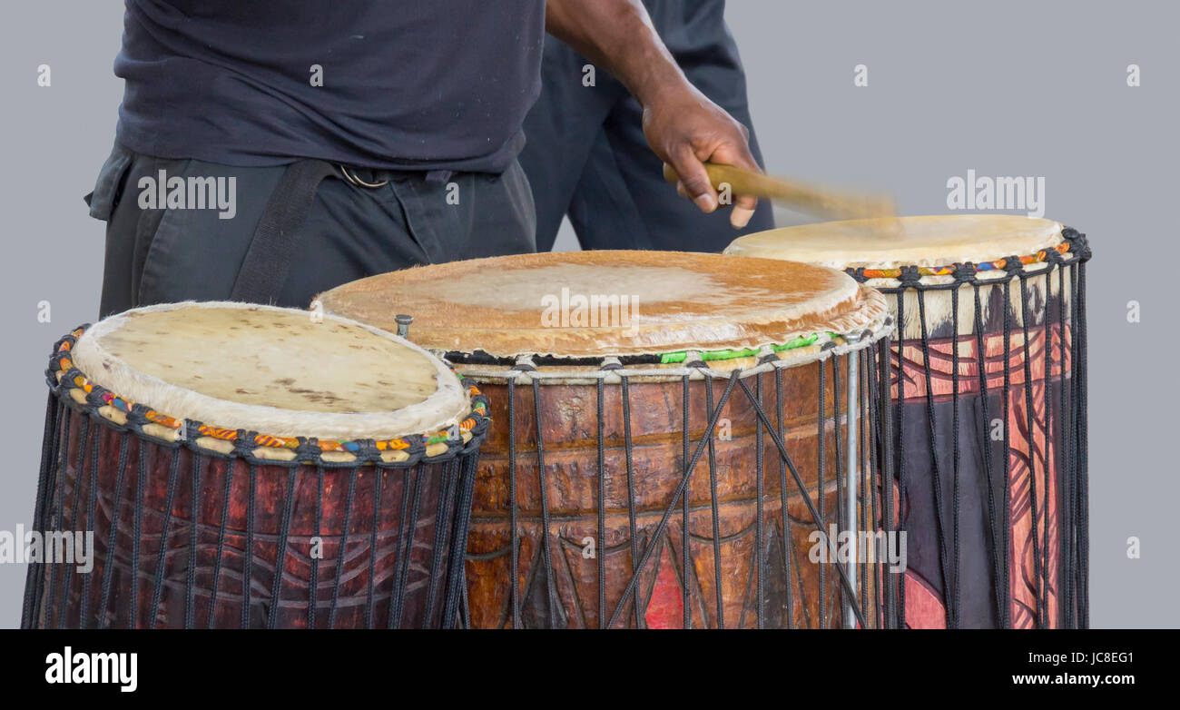 detail of a african drum player in grey back Stock Photo
