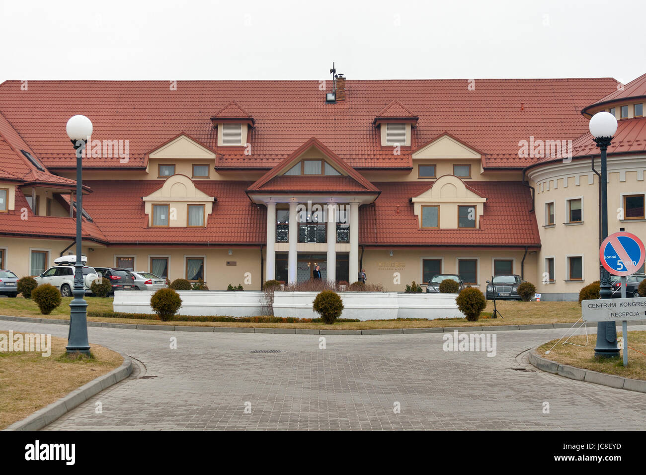 RAWA MAZOWIECKA, POLAND - MARCH 07, 2015: Cars parked in front of luxury Hotel Ossa Congress and Spa during international congress. Hotel is situated  Stock Photo