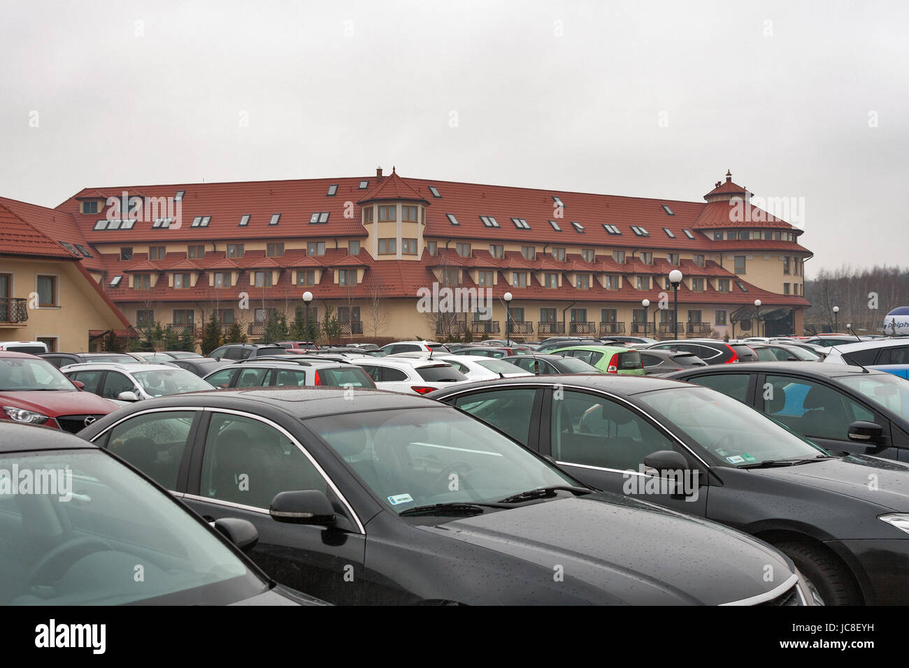 RAWA MAZOWIECKA, POLAND - MARCH 07, 2015: Cars parked in front of luxury Hotel Ossa Congress and Spa during international congress. Hotel is situated  Stock Photo