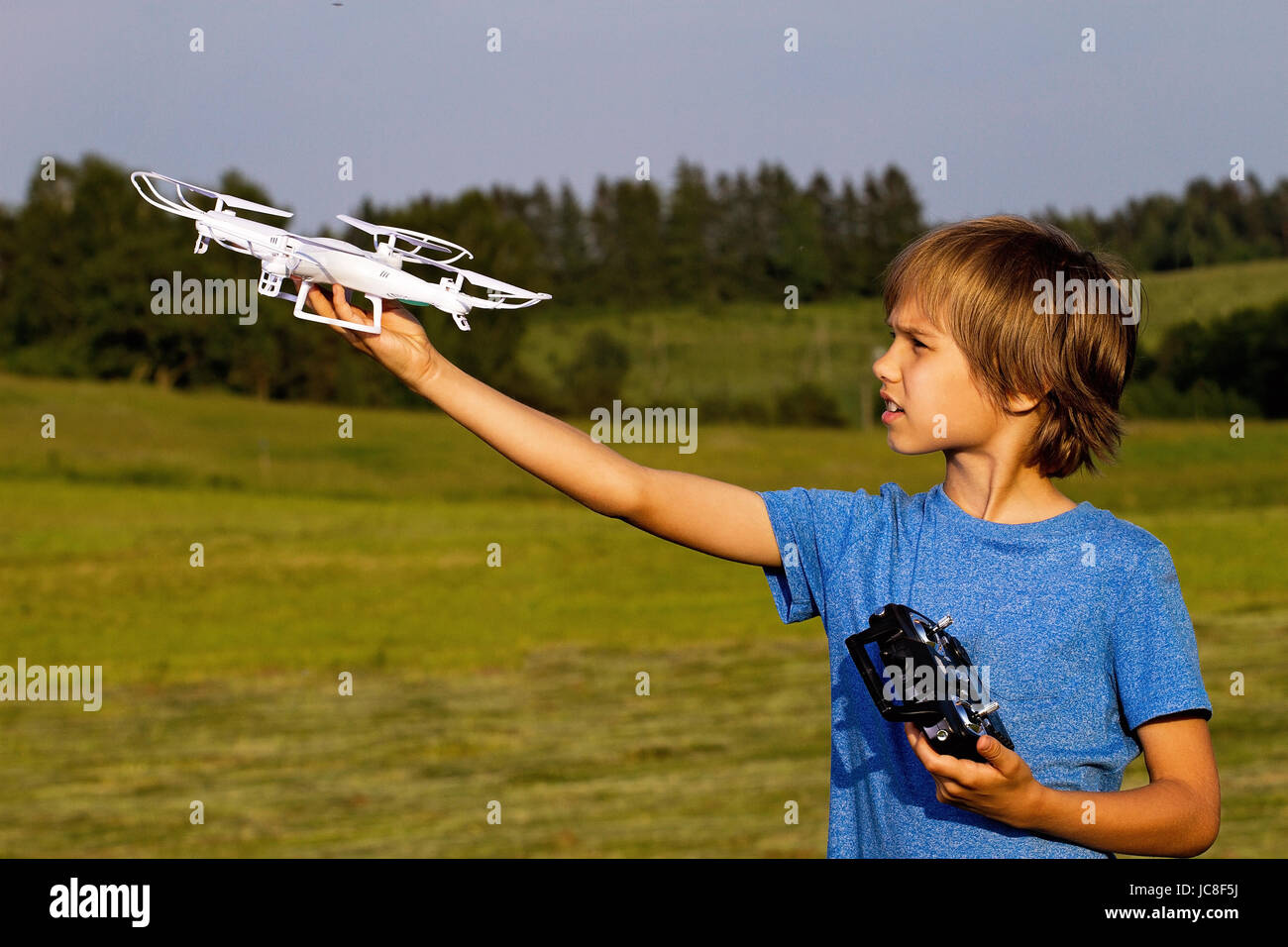 Little boy playing with drone in summer day outdoors Stock Photo - Alamy