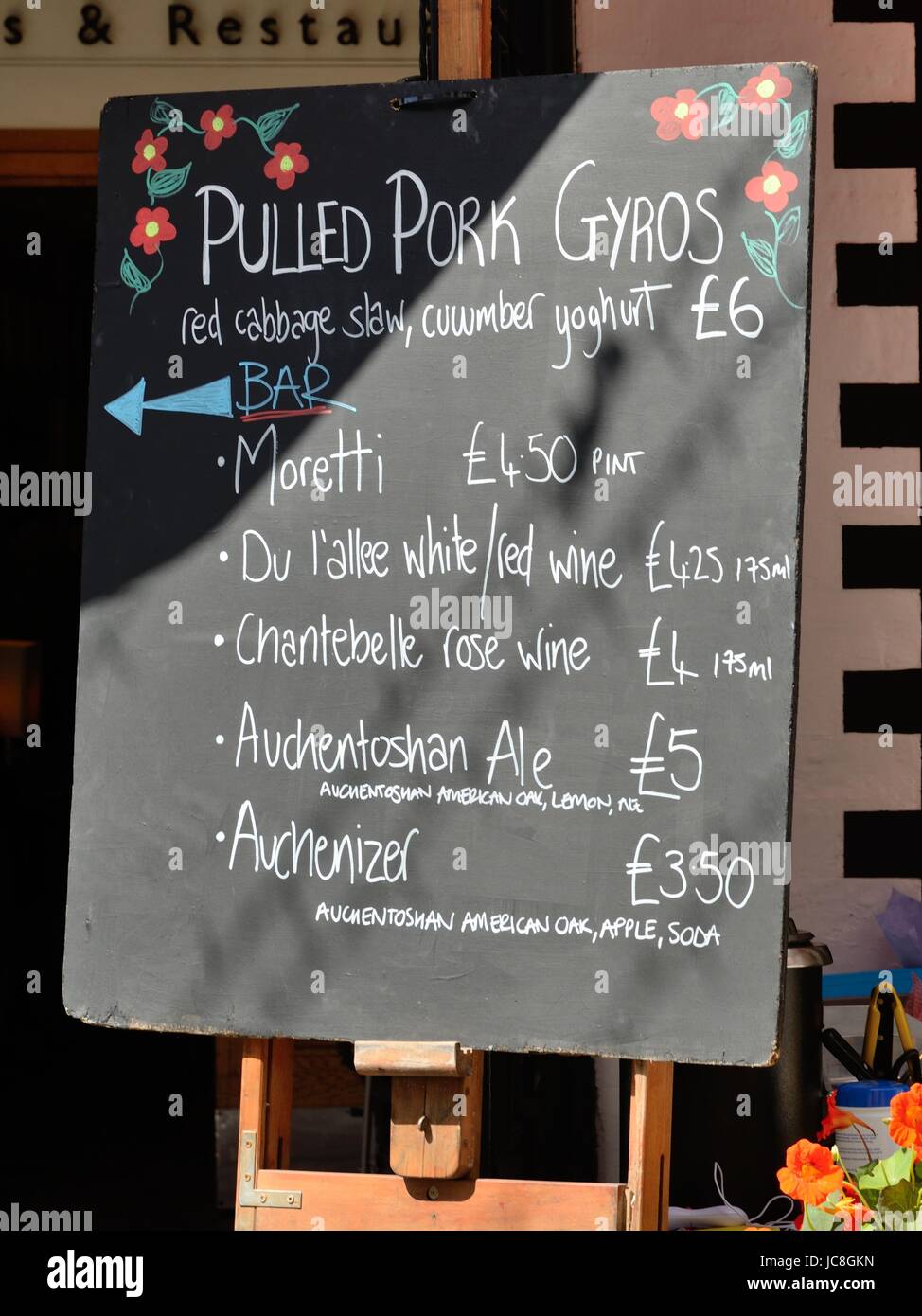 Chalkboard drinks menu outside restaurant entrance in Ashton Lane, Glasgow, Scotland, UK Stock Photo