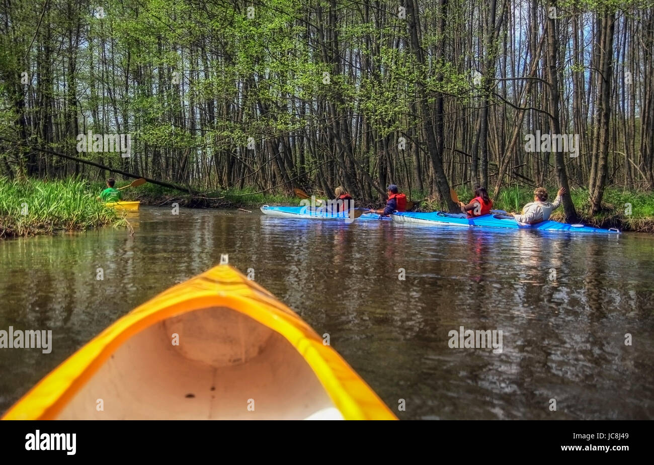 Tourists kayaking on river Stock Photo