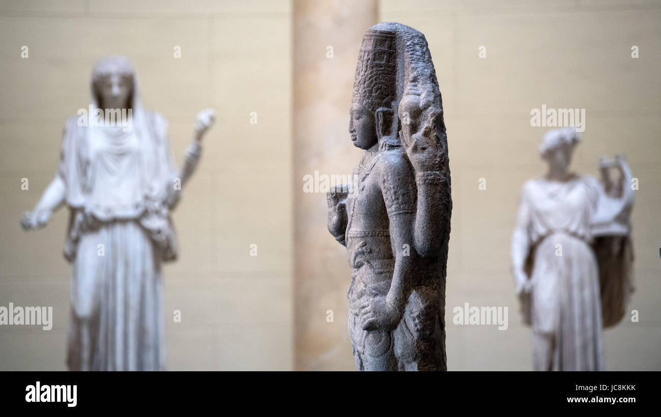 Berlin, Germany. 14th Jun, 2017. A figure of the Indian Hindu God Vishnu from the 8th or 9th Century stands between two Roman sculptures at the special exhibition 'New Neighbours. On the Way to Humboldt Forum' at the Neues Museum in Berlin, Germany, 14 June 2017. Numerous objects of the Museum for Asiatic Arts and of the Ethnolocial Museum of Berlin have been transferred to the Humboldt Forum. Credit: dpa picture alliance/Alamy Live News Stock Photo