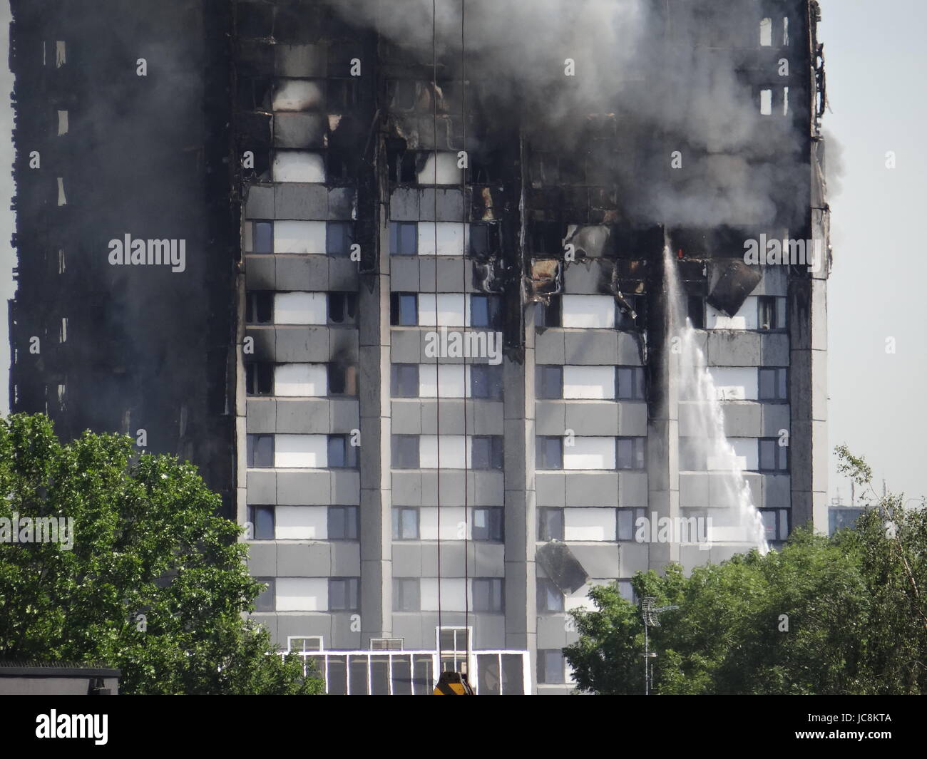 London, UK. 14th June, 2017. Fire fighters are trying to stop he fire in West London where the Grenfell Tower was blazing over night, meannwhile the North Kensington stuck in traffic as some of the roads were closed due to the probability of building's collapse, London, UK. Credit: Nastia M/Alamy Live News Stock Photo