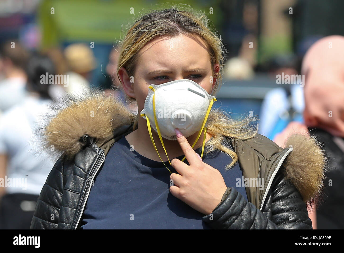 Woman wearing a ripped face mask hi-res stock photography and images ...