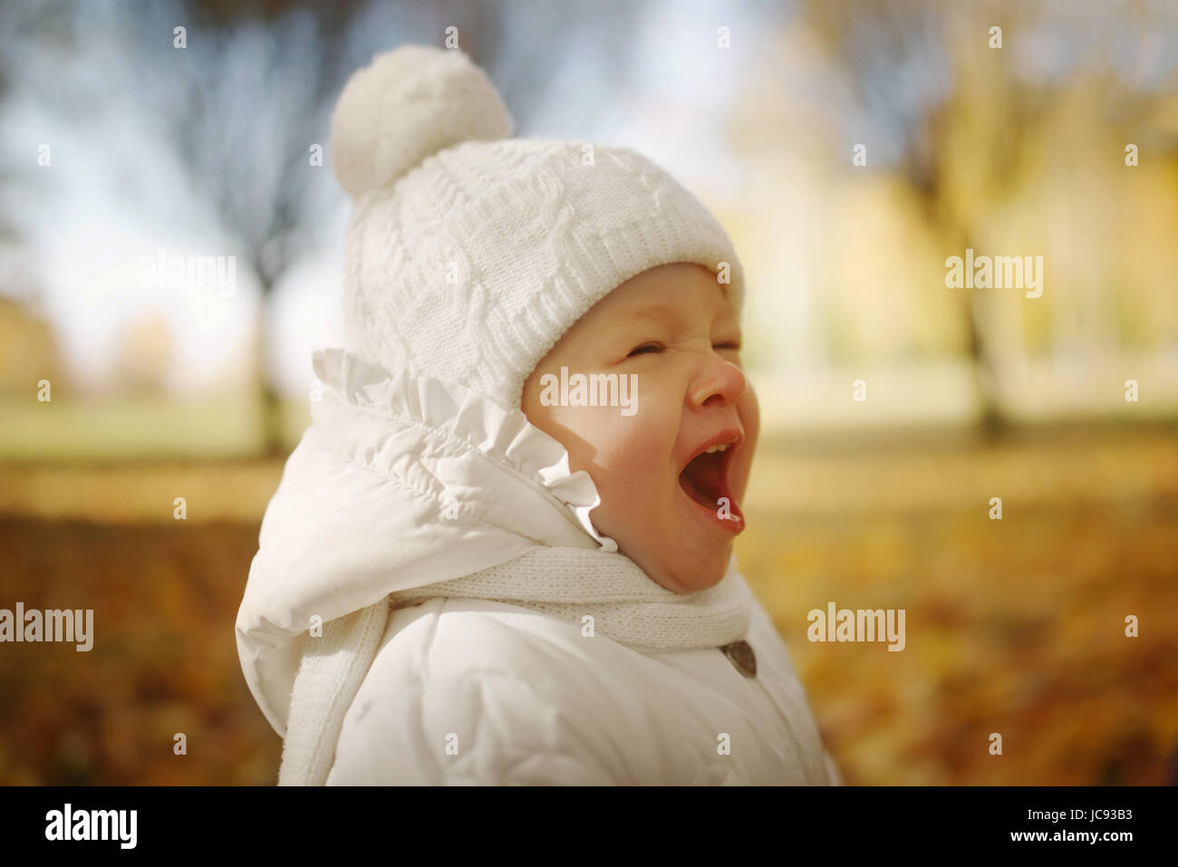 happy little girl in autumn park Stock Photo - Alamy